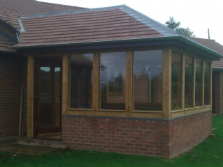 Oak framed conservatory with hipped roof