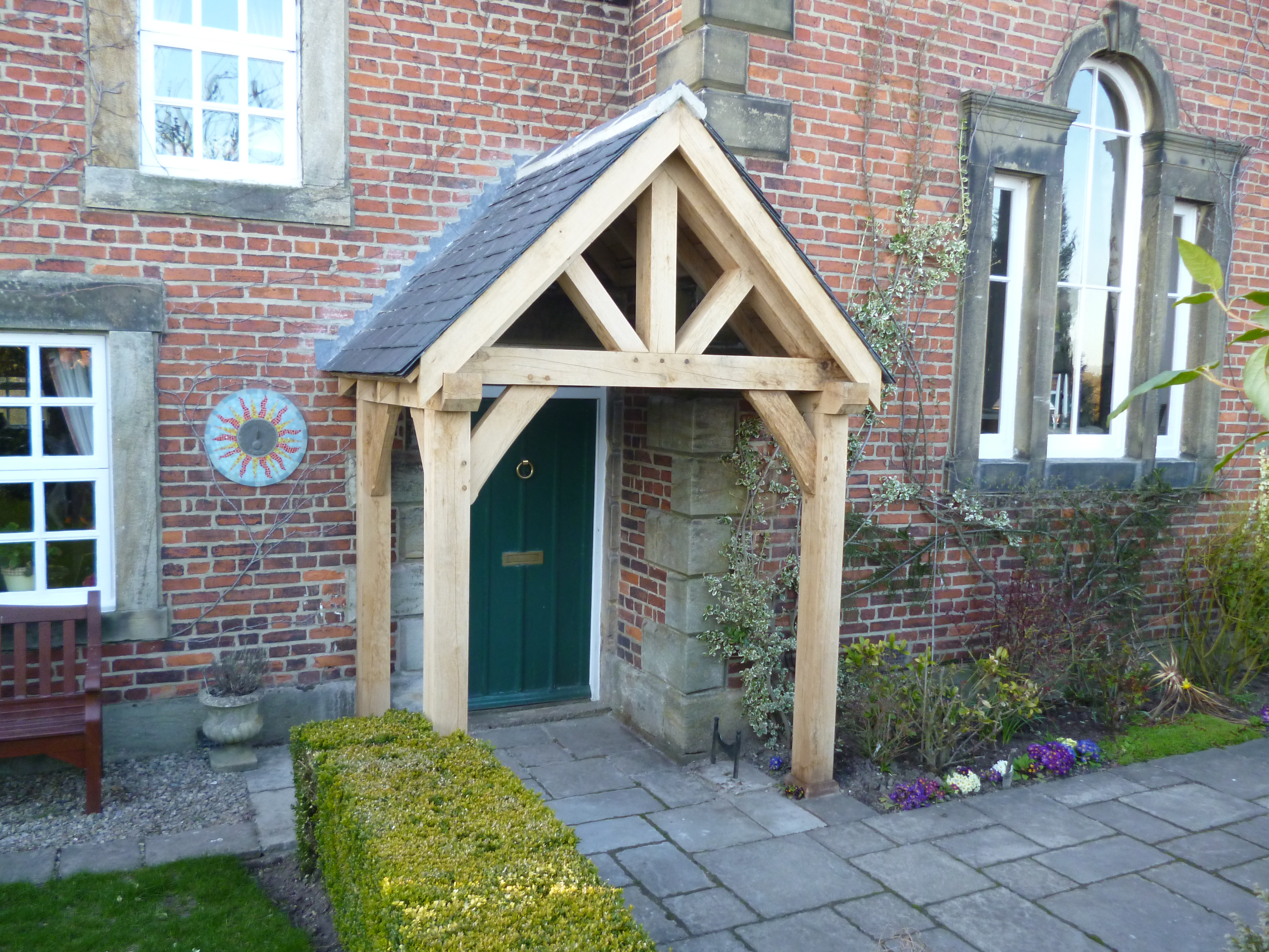 Oak porch with four posts and curved braces