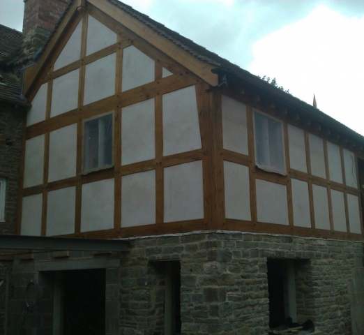 Oak framed extension with rendered panels