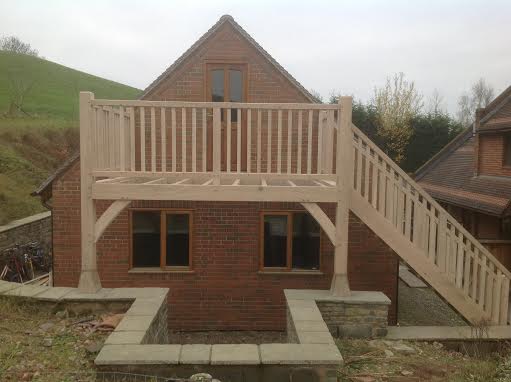 Oak framed balcony with stairs fitted to garage end
