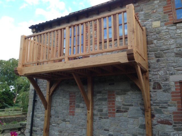 Oak framed balcony with large oak brackets