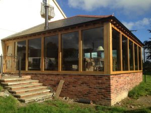 Oak and glass extension frame in mid wales