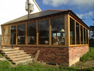 Large oak framed extension with glass