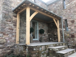Oak lean too with a glazed side frame and hipped roof