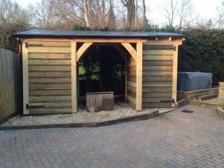 Oak framed shed with log store