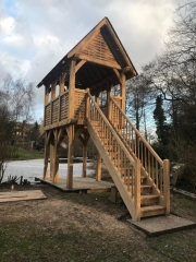 Oak framed boathouse iwth weaved panels and green oak staircase