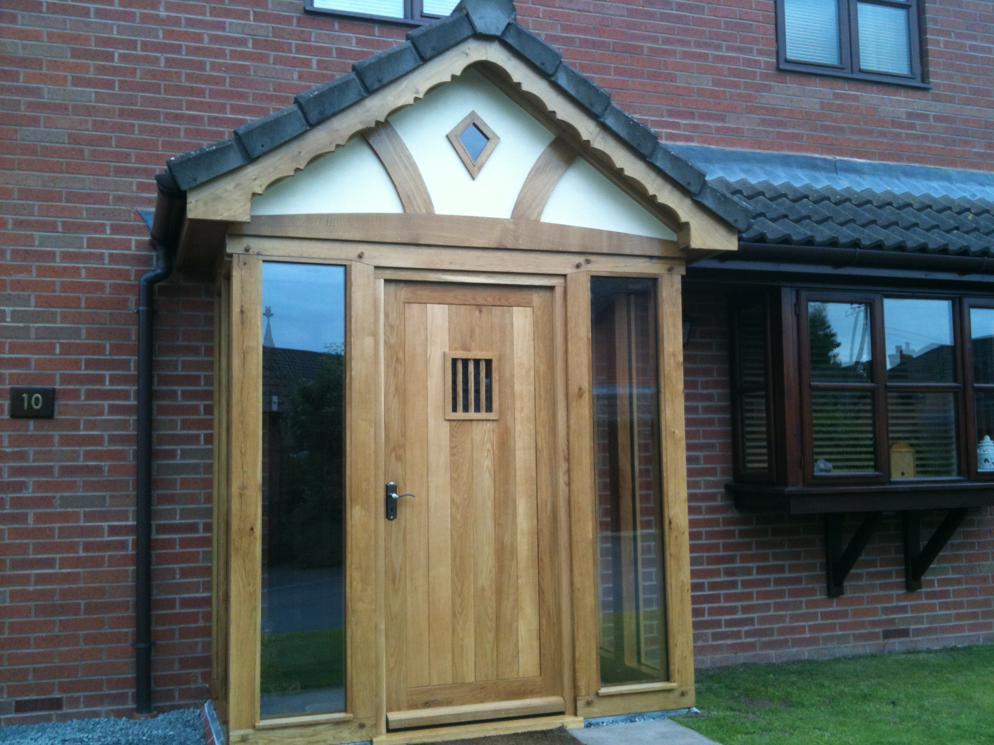 Enclosed oak framed porch with full length glass