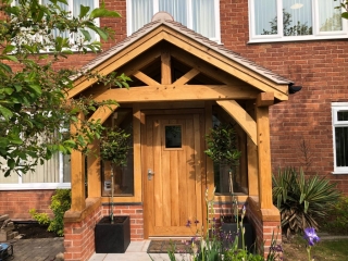Enclosed oak framed porch Malvern with oak door and tiled roof