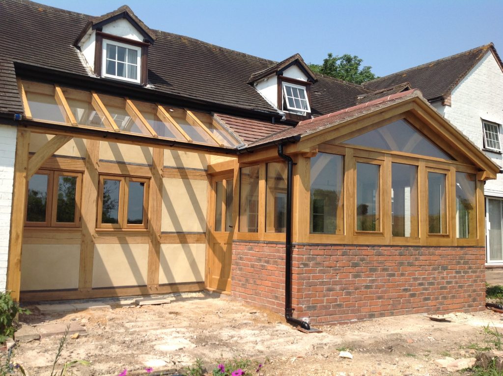 Oak Conservatory with dwarf walls and glazed lean too.