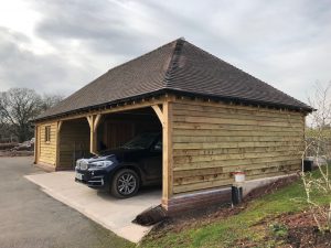 Oak garage with hipped roof