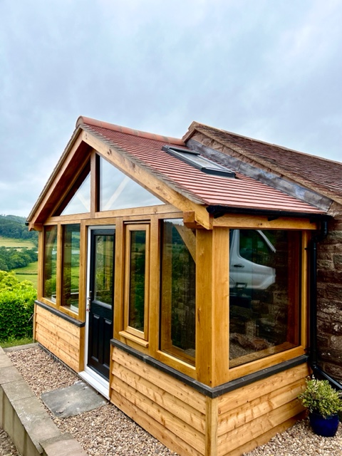 A glass and clad oak frame garden room.