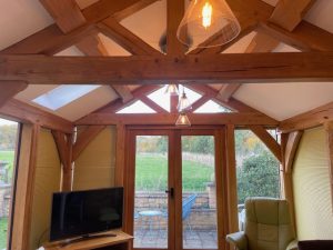 Internal shot of oak framed conservatory feature two oak trusses.